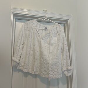 White embroidered lined top by cake for dinner